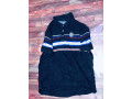 instant-une-nouvelle-deballage-de-t-shirt-polo-a-la-boutique-nous-sommes-situes-a-la-patte-doie-derriere-lyza-market-small-2